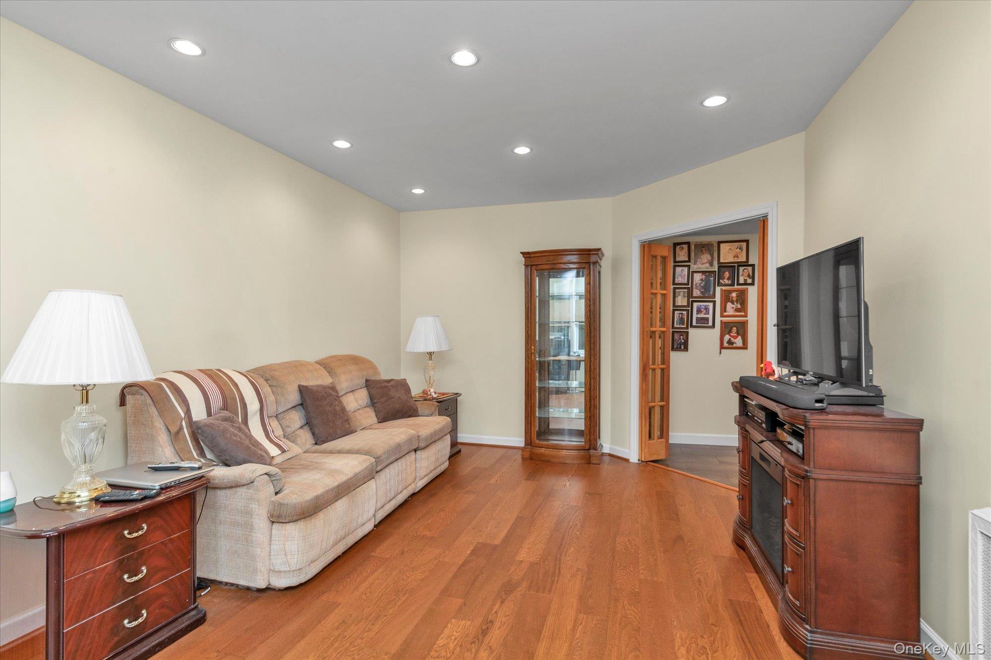 32 5th Street Valley Stream, NY 11581 - Photo 2 of 23 a living room with furniture and a flat screen tv