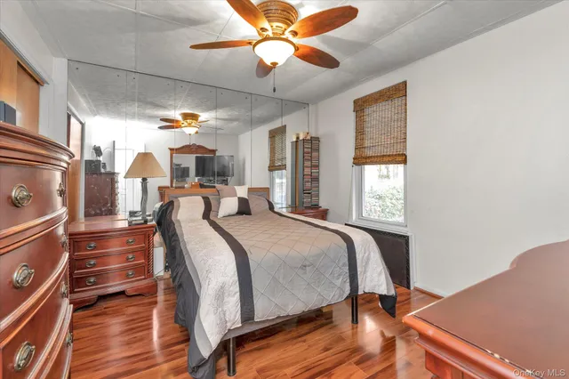 a bed room with a bed and a chandelier