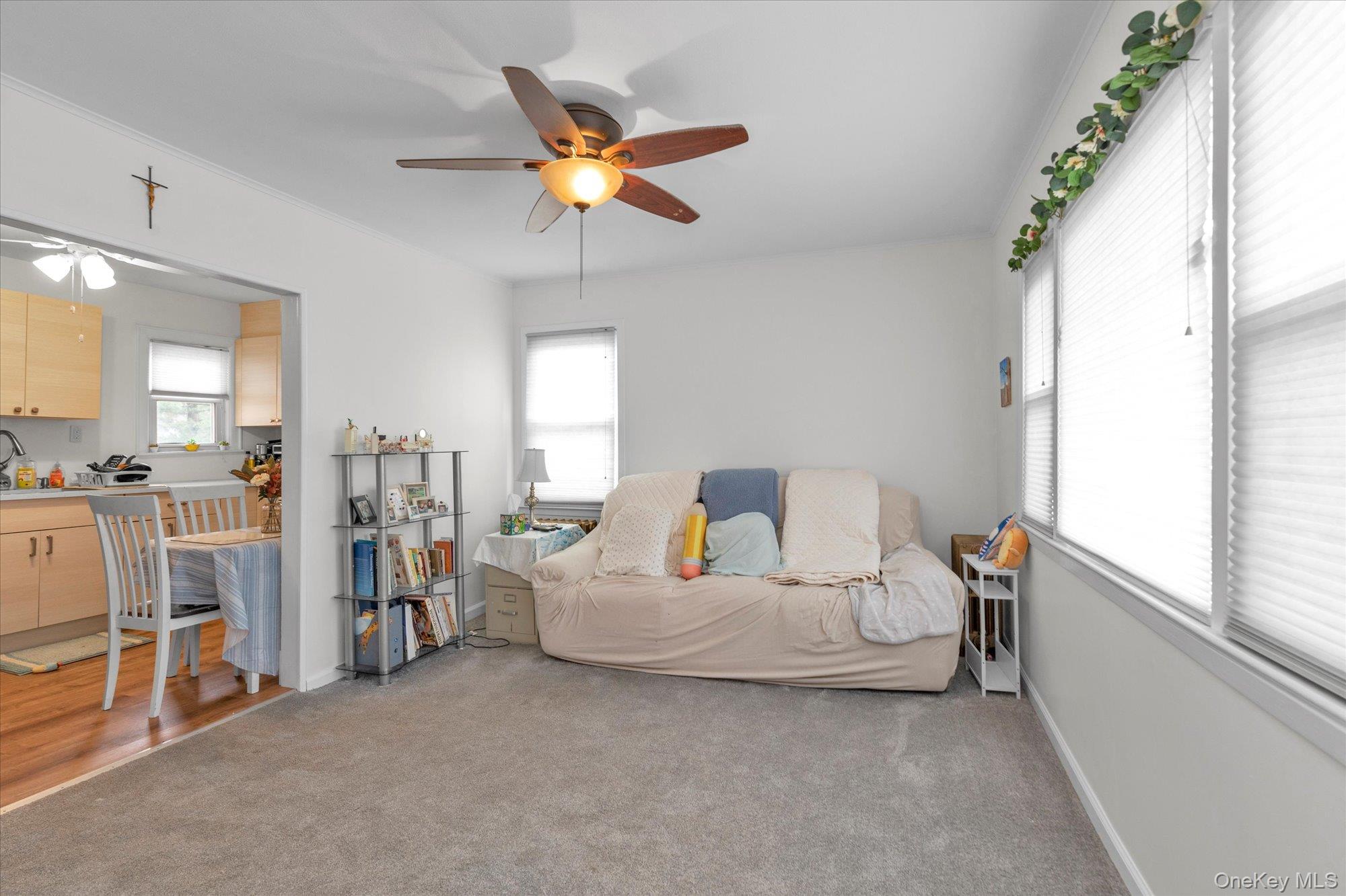 32 5th Street Valley Stream, NY 11581 - Photo 9 of 23 a living room with furniture and a chandelier