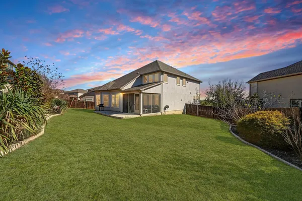a view of a house with a big yard