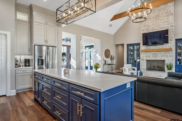 a view of kitchen with sink microwave and refrigerator