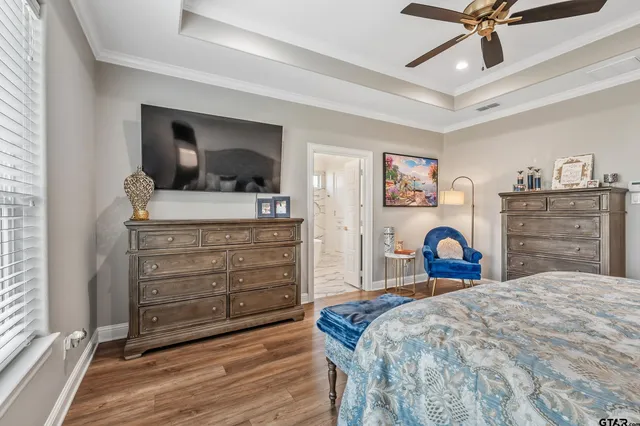 a bedroom with a bed and a dresser