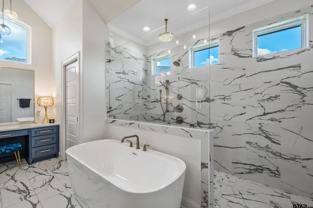 a bathroom with a sink vanity granite and a toilet
