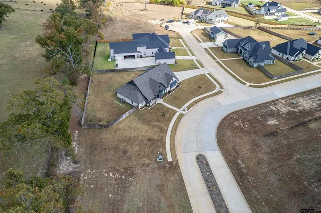 an aerial view of a house with a ocean view