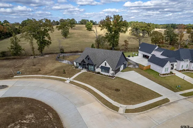 a view of a swimming pool with a yard and mountain view