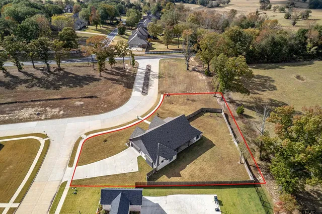 an aerial view of a house with swimming pool