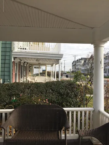 a front view of a house with a porch