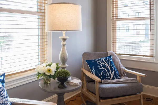 a living room with furniture and a potted plant