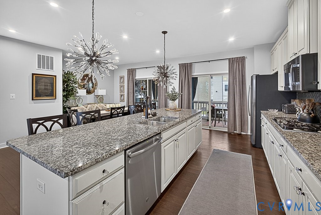 17976 Spotted Oak Road Dumfries, VA 22026 - Photo 6 of 52 Kitchen island with light-toned granite countertop