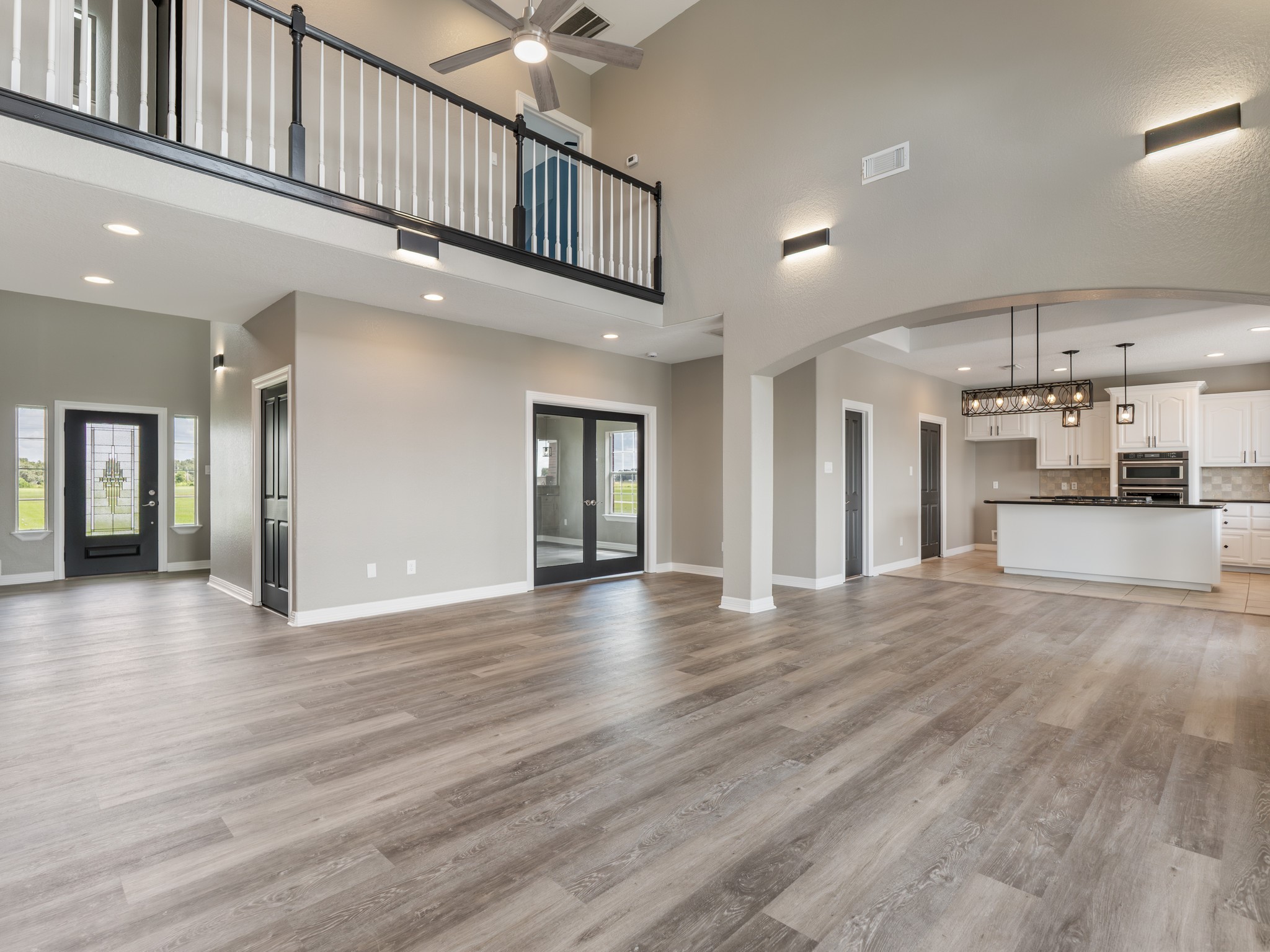 863 Bunkhouse Trail Angleton, TX 77515 - Photo 12 of 42 French doors on the left open to a private home office