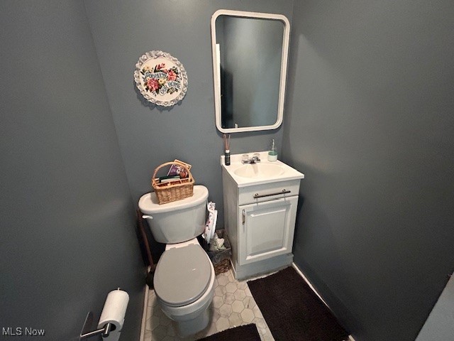48 North Firestone Road Wooster, OH 44691 - Photo 8 of 22 Bathroom featuring tile patterned floors, toilet, and vanity