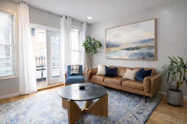 a living room with furniture and a large window