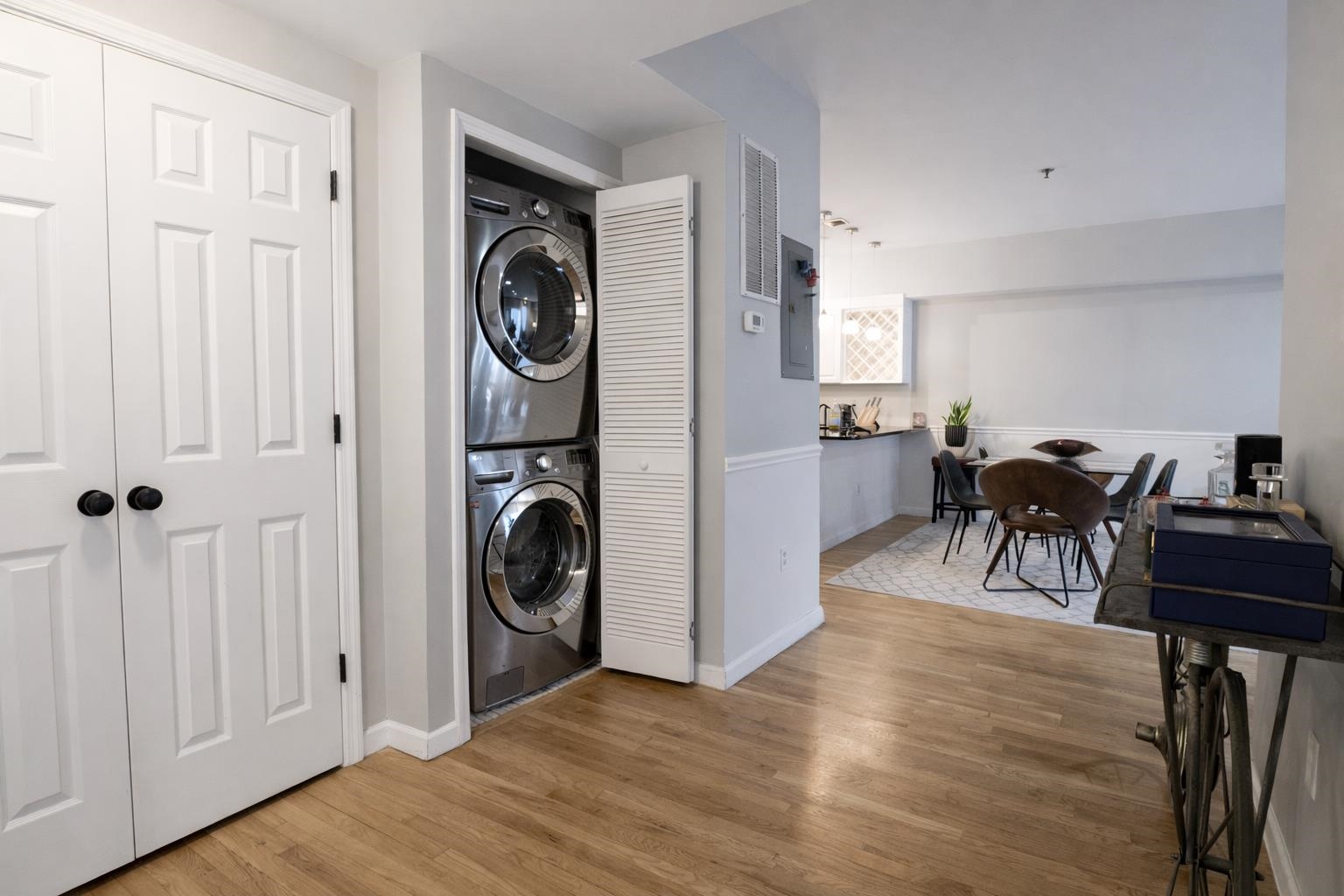 901 Madison Street, Unit 5F Hoboken, NJ 07030 - Photo 14 of 20 a view of a hallway with dining table and chairs