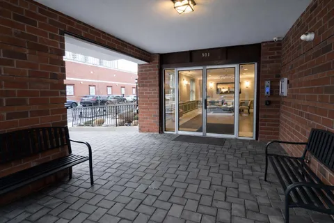 a view of a patio with a table and chairs