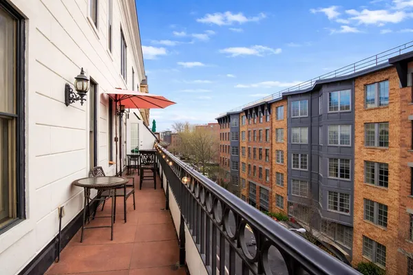 a view of a balcony with chairs