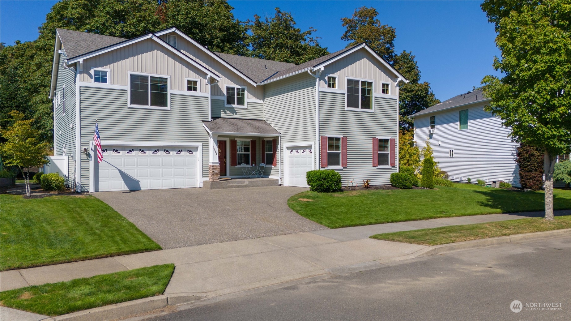 3139 Walker Road DuPont, WA 98327 - Photo 2 of 40 a front view of a house with a yard and garage