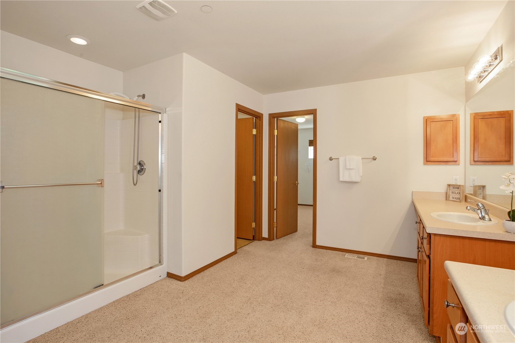 3139 Walker Road DuPont, WA 98327 - Photo 28 of 40 a bathroom with a sink and a mirror