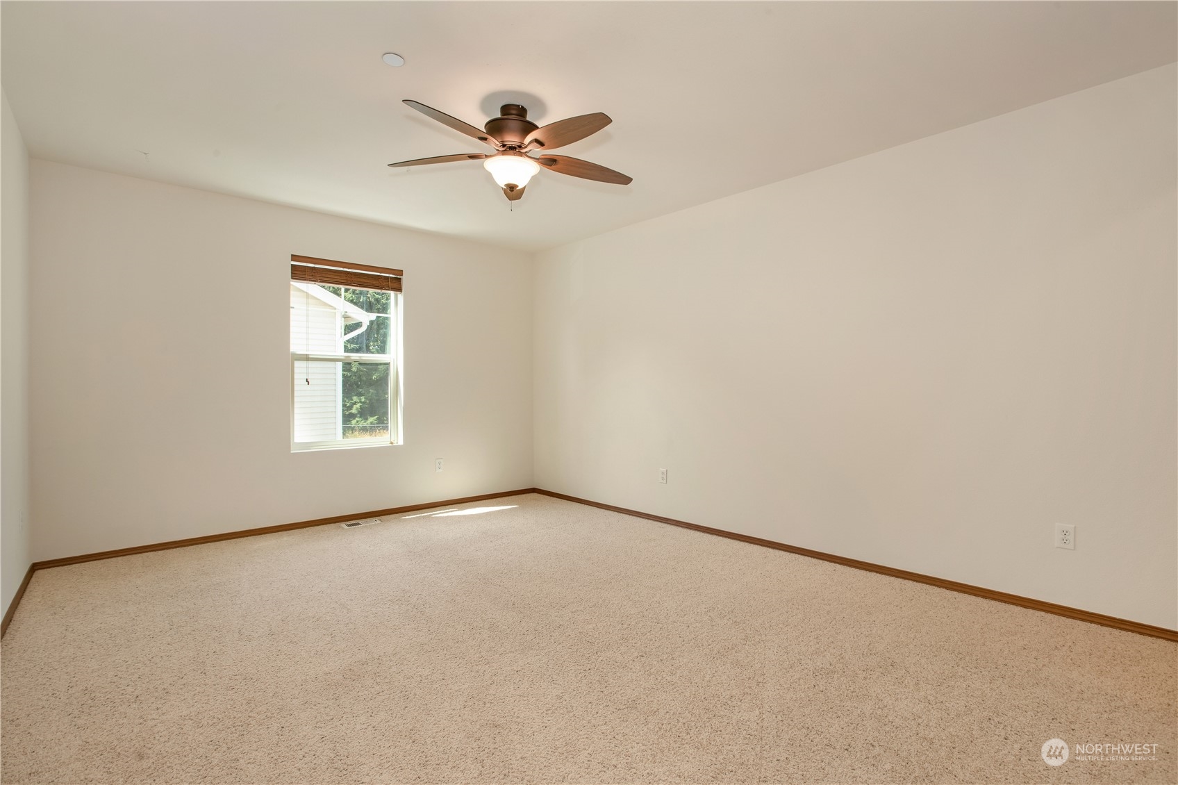 3139 Walker Road DuPont, WA 98327 - Photo 31 of 40 an empty room with windows and fan