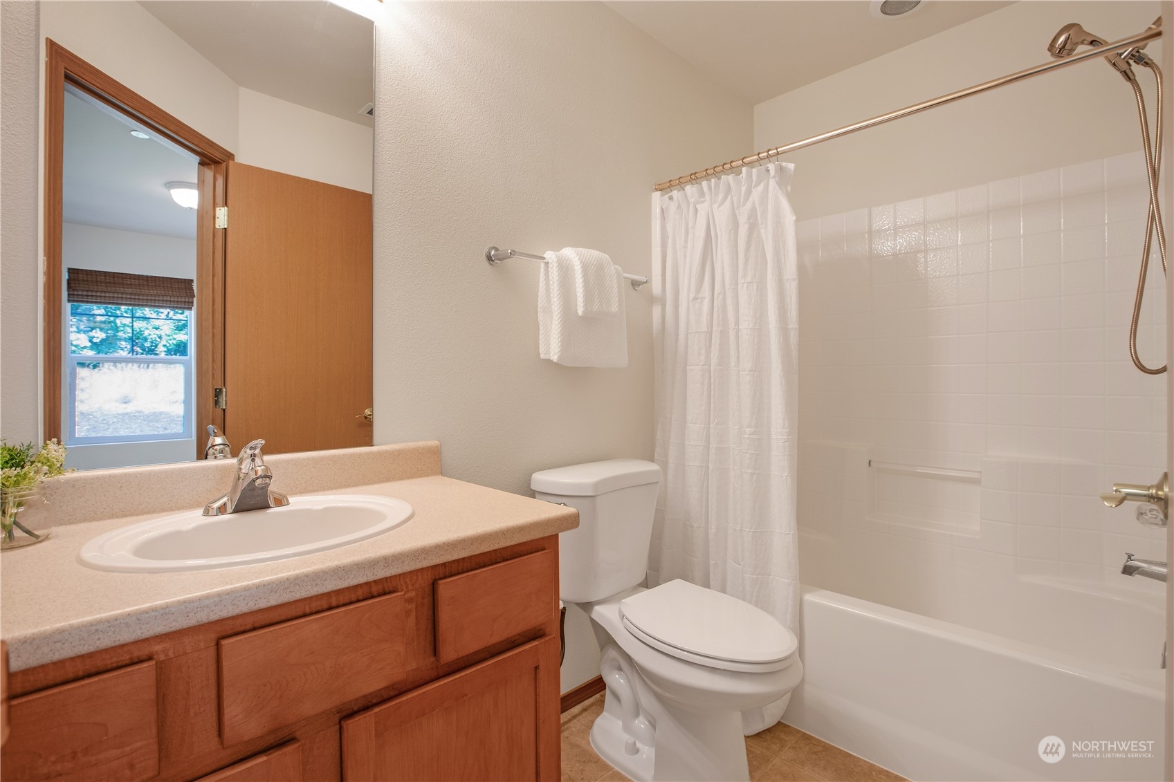 3139 Walker Road DuPont, WA 98327 - Photo 9 of 40 a bathroom with a sink toilet and shower