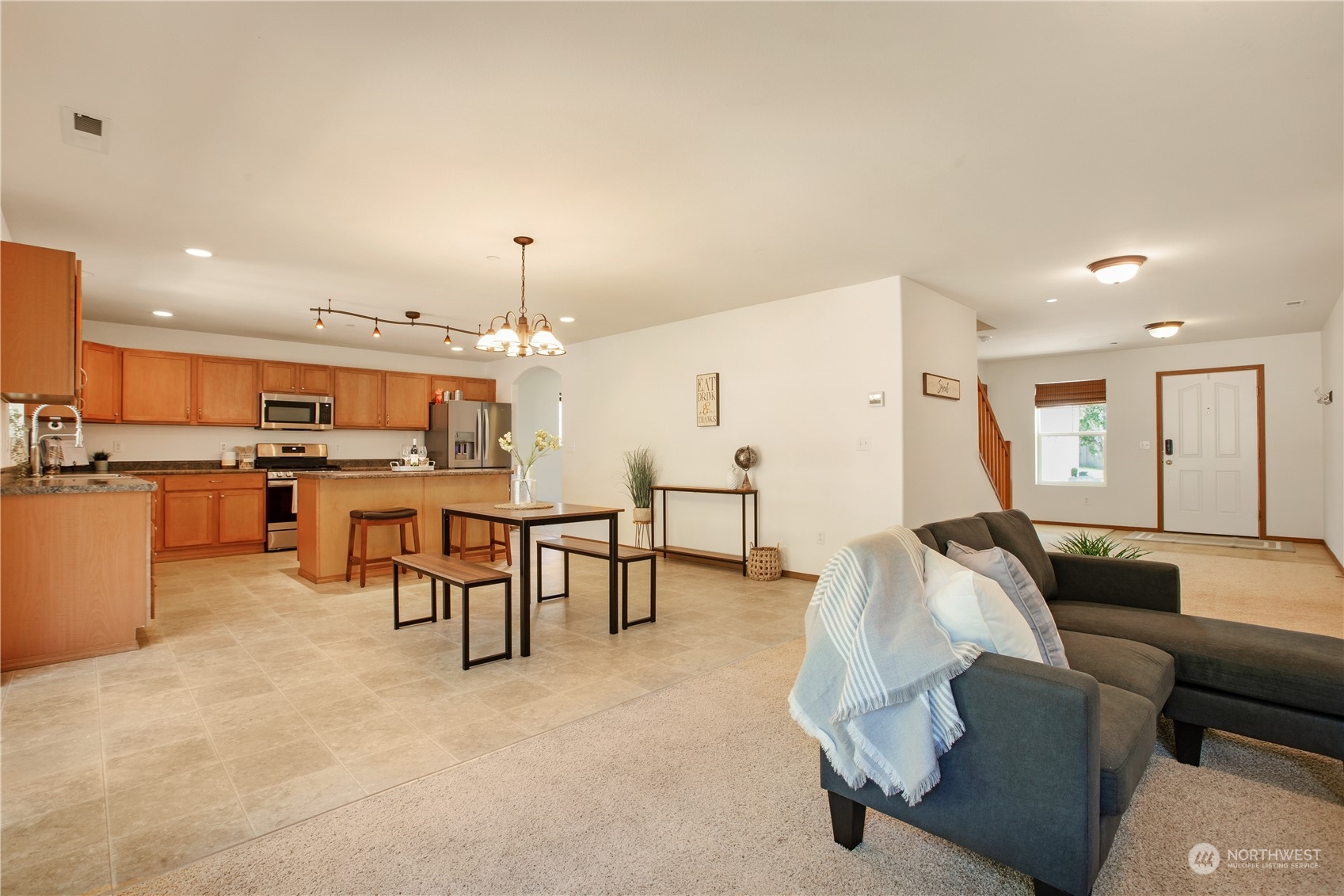 3139 Walker Road DuPont, WA 98327 - Photo 10 of 40 a living room with furniture and kitchen view