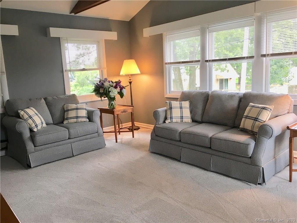 87 Decatur Avenue Guilford, CT 06437 - Photo 11 of 29 a living room with furniture and a large window