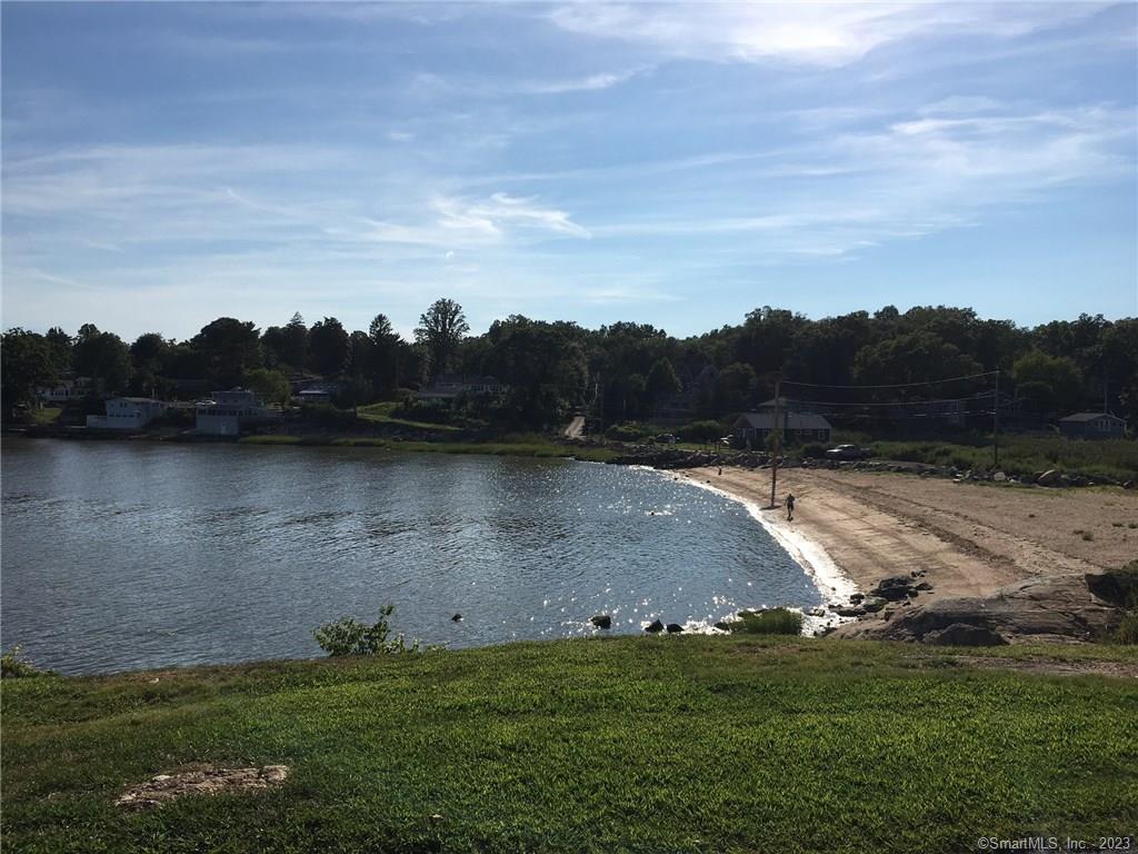 87 Decatur Avenue Guilford, CT 06437 - Photo 29 of 29 a view of a lake with green field and trees