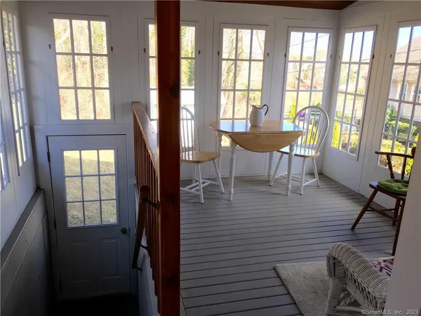 a view of a dining room with furniture and windows