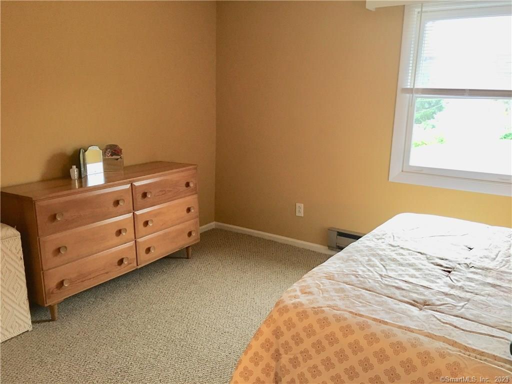 87 Decatur Avenue Guilford, CT 06437 - Photo 6 of 29 a bedroom with a bed and a window