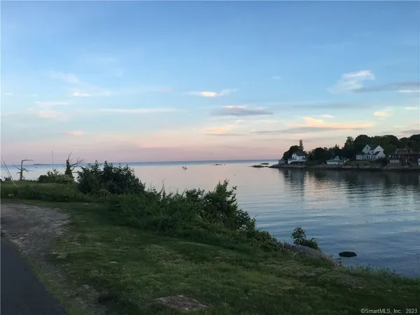 a view of lake with green space