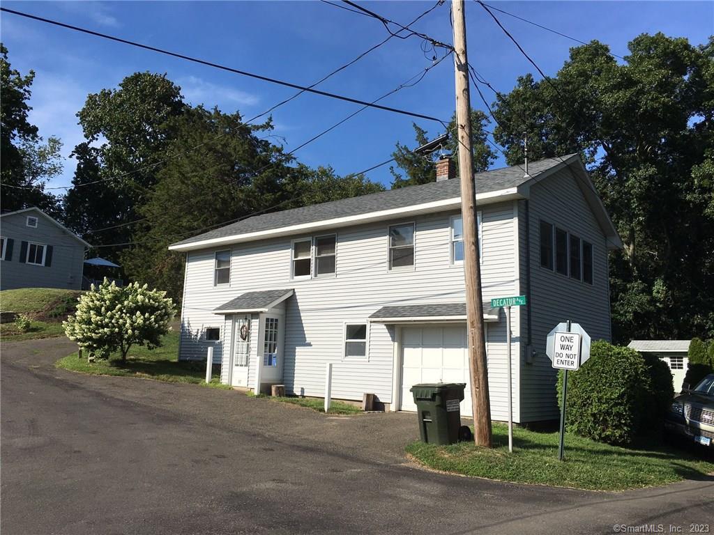 87 Decatur Avenue Guilford, CT 06437 - Photo 10 of 29 a front view of a house with garden
