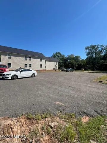 a view of parking with cars parked