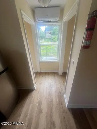a view of outdoor space with wooden floor and window