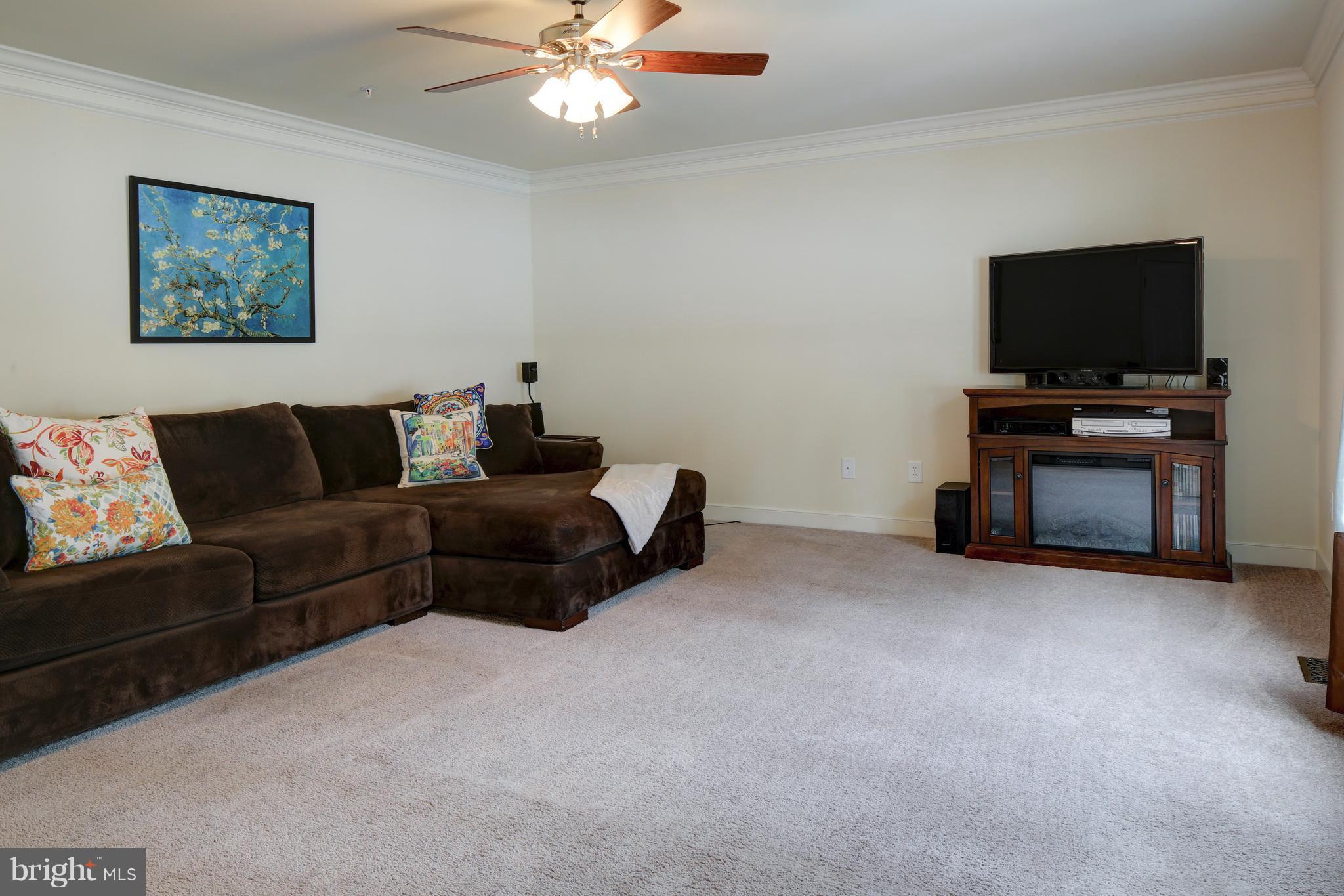 339 Chestnut Road Linthicum Heights, MD 21090 - Photo 9 of 30 a living room with furniture and a flat screen tv