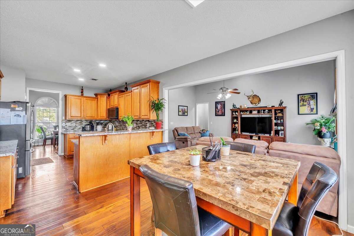 605 Dodds Walk Macon, GA 31220 - Photo 14 of 68 a view of a dining room with furniture and wooden floor