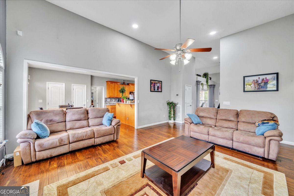 605 Dodds Walk Macon, GA 31220 - Photo 15 of 68 a living room with furniture and a chandelier