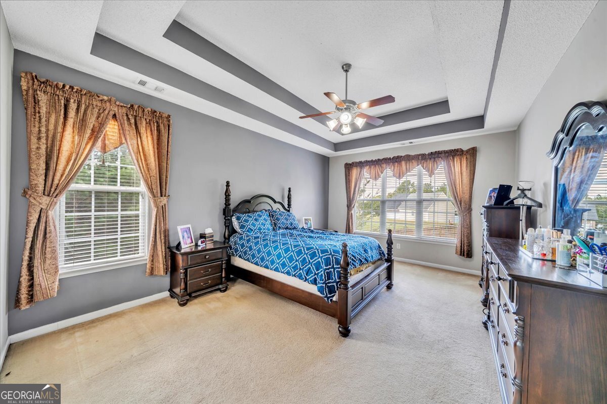 605 Dodds Walk Macon, GA 31220 - Photo 16 of 68 a bedroom with furniture and a large window