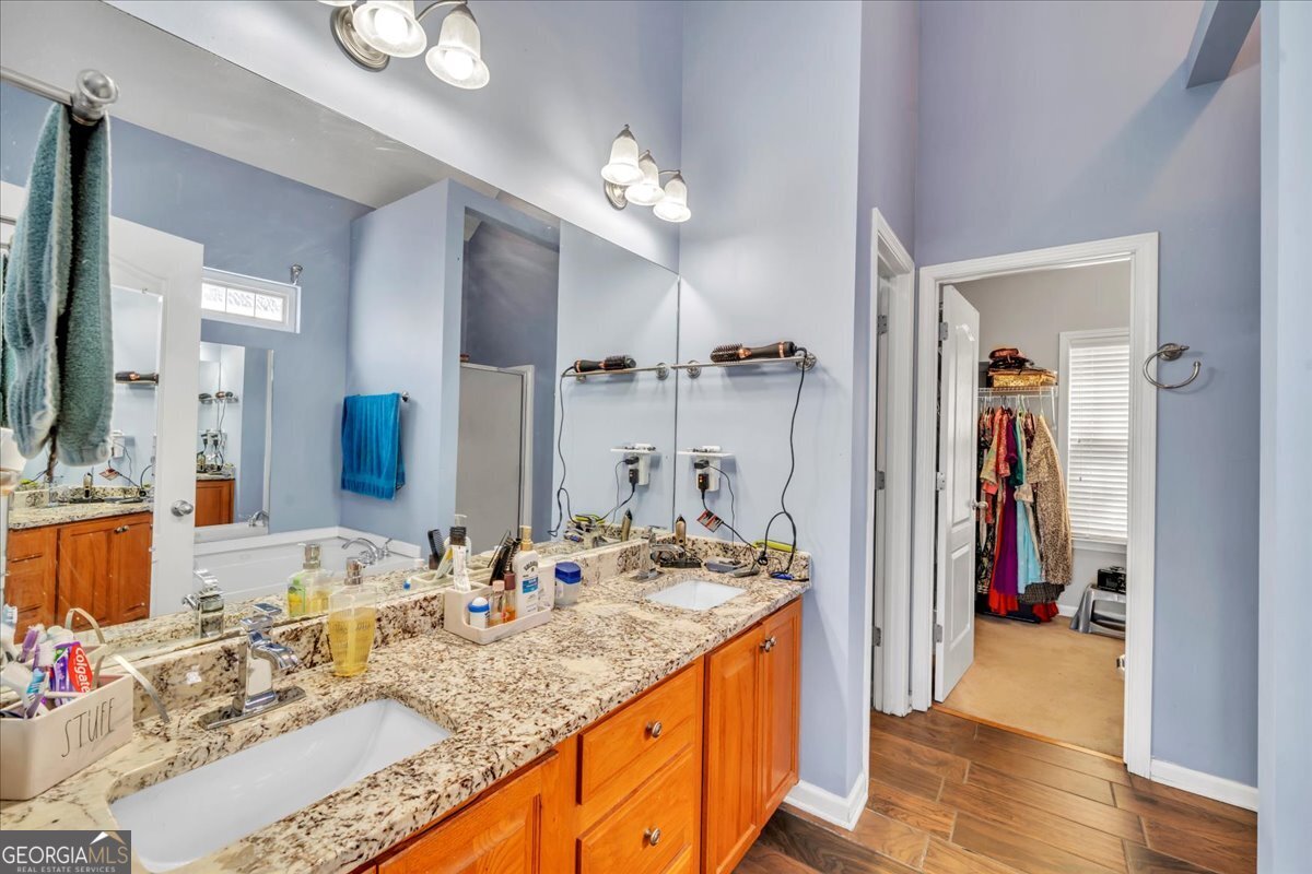 605 Dodds Walk Macon, GA 31220 - Photo 20 of 68 a bathroom with sink a vanity and shower