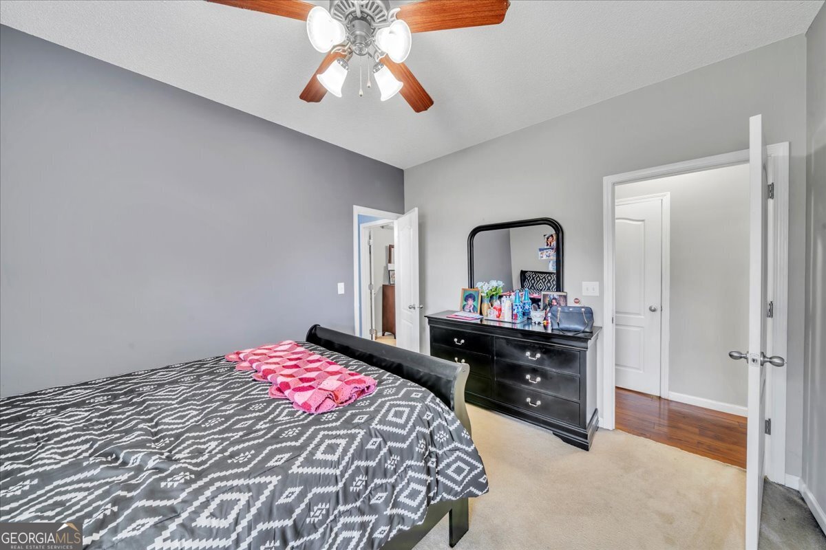 605 Dodds Walk Macon, GA 31220 - Photo 30 of 68 a bedroom with a bed and a dresser