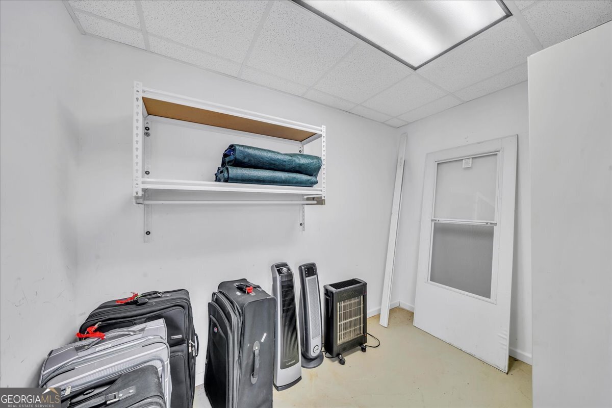 605 Dodds Walk Macon, GA 31220 - Photo 46 of 68 a view of walk in closet with clothes and shoes