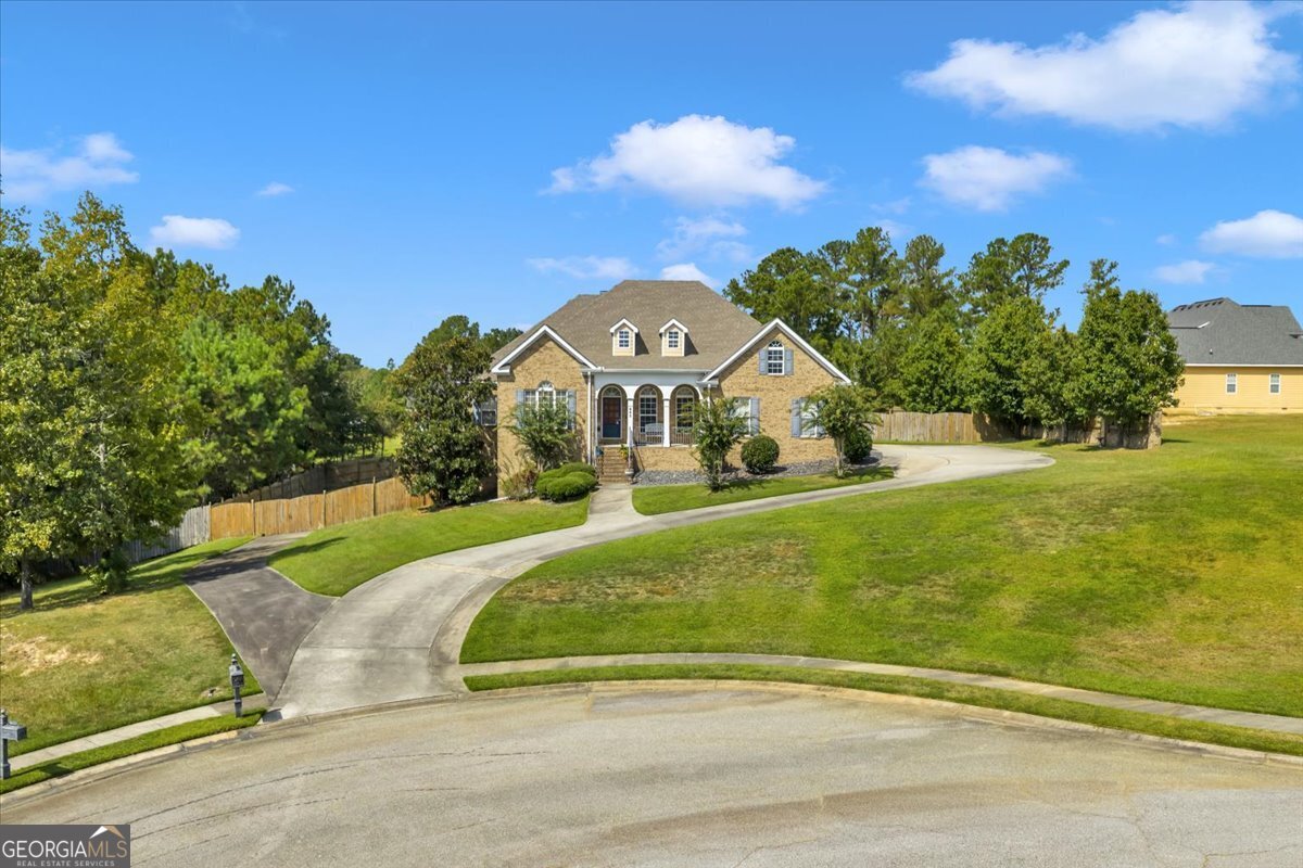 605 Dodds Walk Macon, GA 31220 - Photo 52 of 68 a view of a house with a big yard plants and large trees
