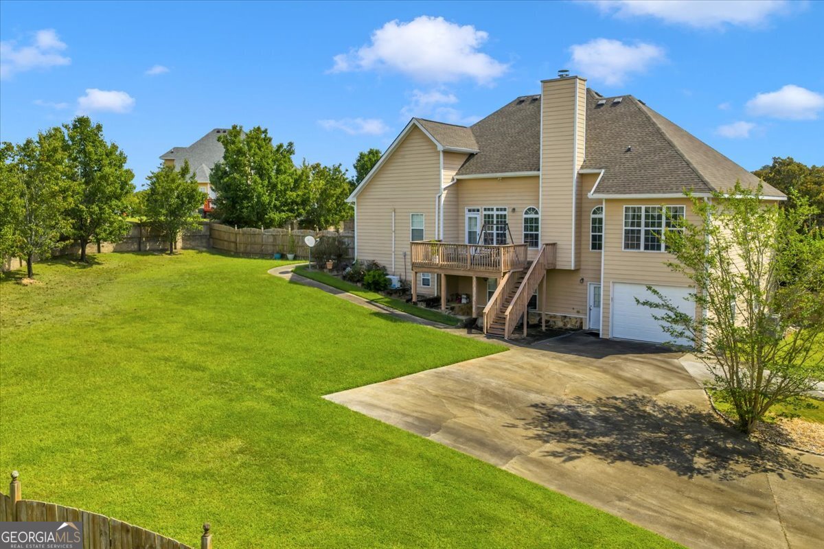 605 Dodds Walk Macon, GA 31220 - Photo 61 of 68 a view of a house with a yard and sitting area