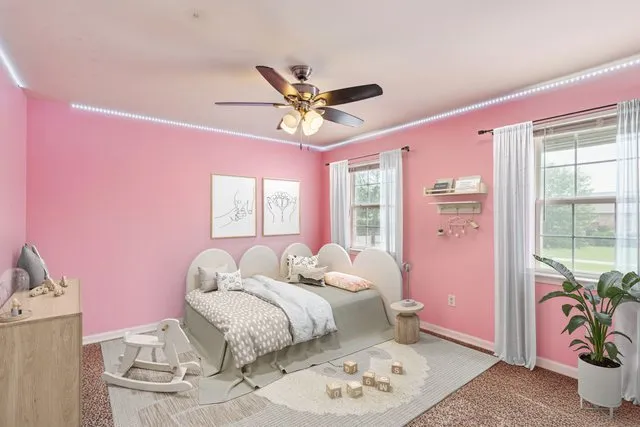 a bed room with a bed and a window