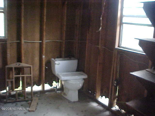 396 Beecher Springs Road Crescent City, FL 32112 - Photo 13 of 17 a white toilet sitting next to a bathroom sink