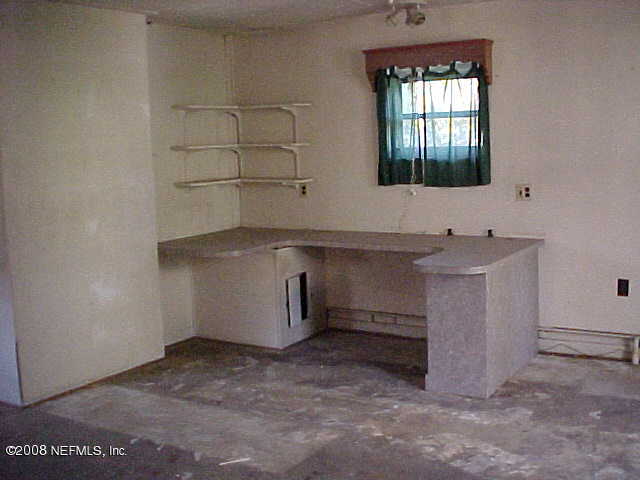 396 Beecher Springs Road Crescent City, FL 32112 - Photo 14 of 17 a room with a sink and cabinets