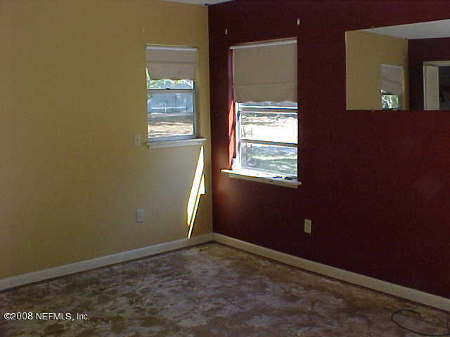 396 Beecher Springs Road Crescent City, FL 32112 - Photo 15 of 17 a view of an empty room with a window