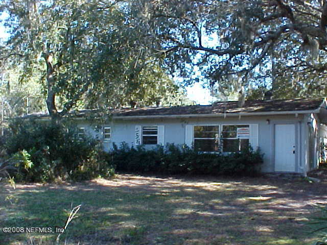 396 Beecher Springs Road Crescent City, FL 32112 - Photo 2 of 17 a backyard of a house with plants and trees