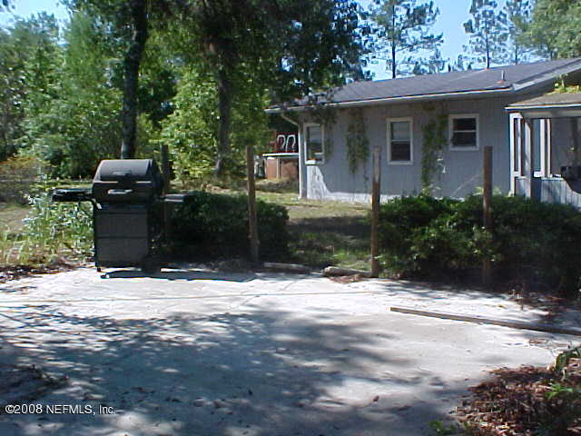 396 Beecher Springs Road Crescent City, FL 32112 - Photo 3 of 17 a view of a house with a yard
