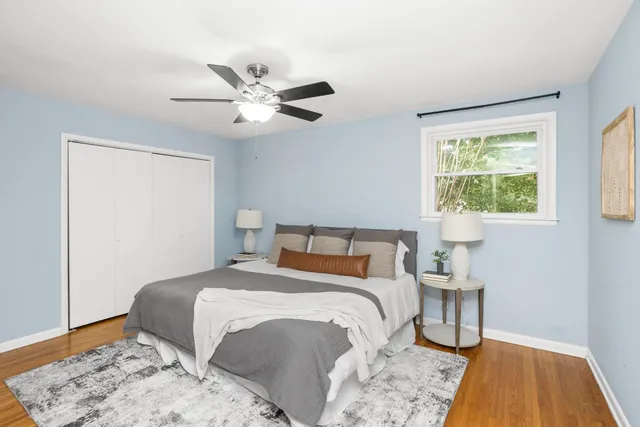 a bedroom with a bed and a window