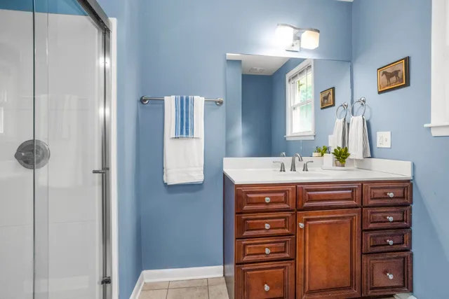 a bathroom with a sink a vanity and a mirror