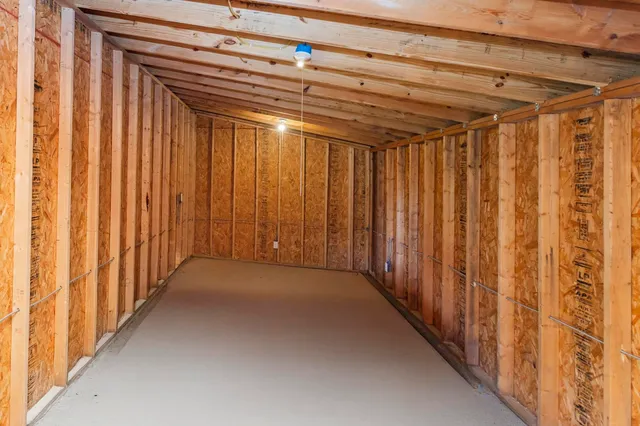 a view of a room with wooden walls